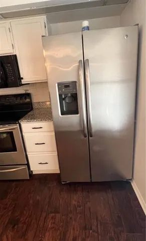 a view of a hardwood floor in a kitchen