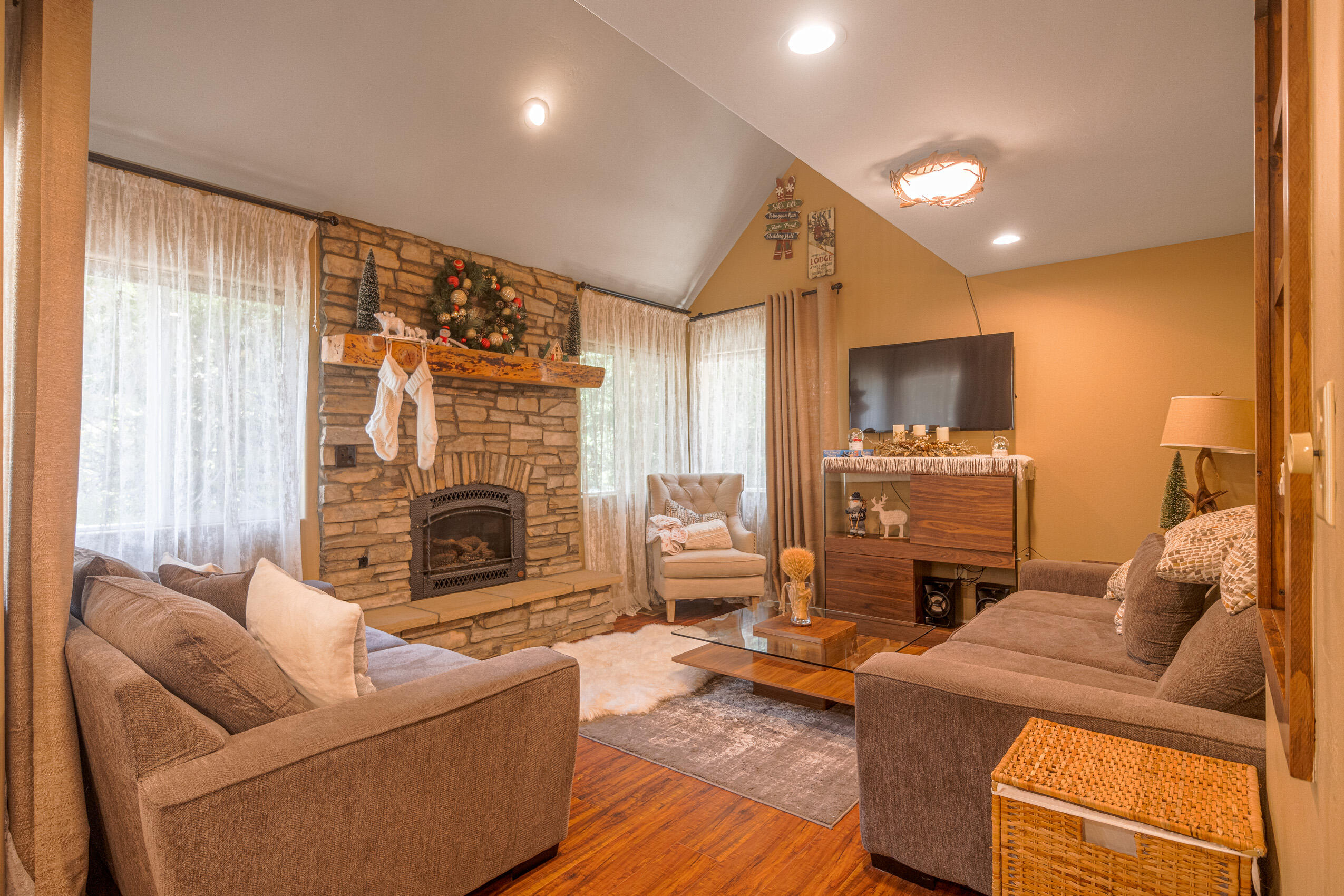 11809 Pine Drive Wofford Heights, CA 93285 - Photo 13 of 33 a living room with furniture a fireplace and a flat screen tv