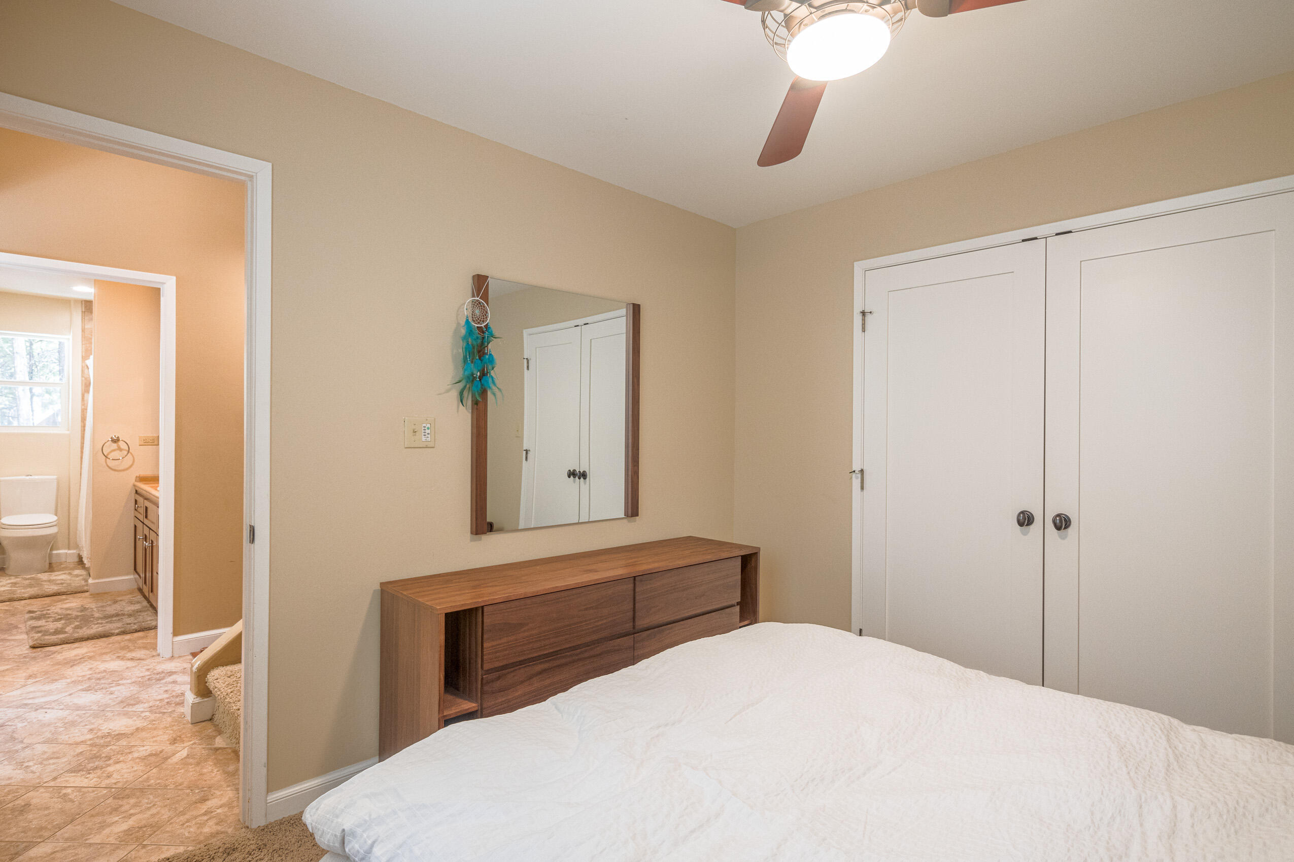 11809 Pine Drive Wofford Heights, CA 93285 - Photo 28 of 33 a bedroom with a bed and a chandelier