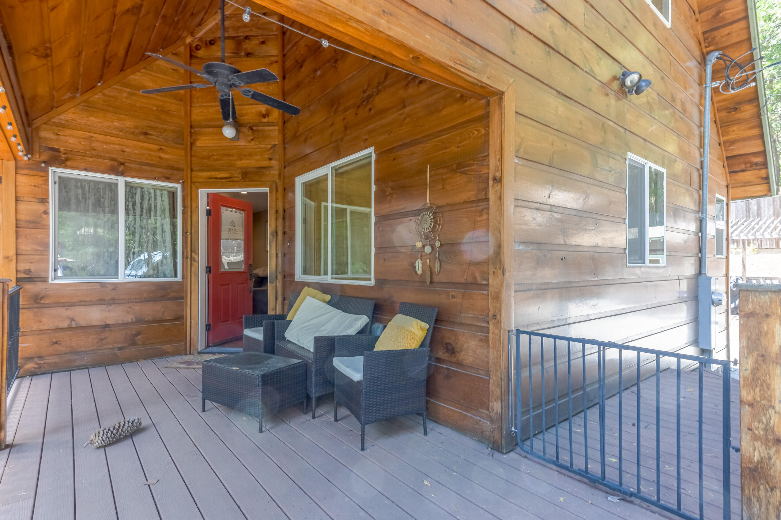 11809 Pine Drive Wofford Heights, CA 93285 - Photo 30 of 33 a view of a patio with table and chairs and wooden floor