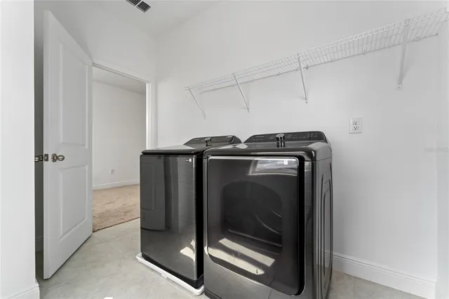 a utility room with washer and dryer