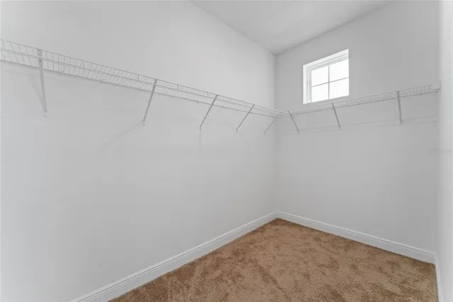 a view of a small space with racks on the wall