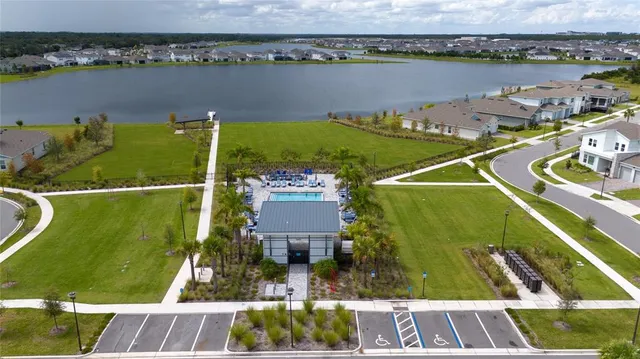 an aerial view of a house with a lake view