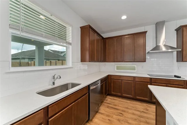 a kitchen with a sink and cabinets