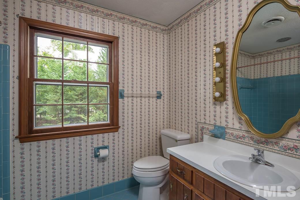 6700 Colony Court Raleigh, NC 27613 - Photo 16 of 21 2nd floor full bath with ceramic tile shower.