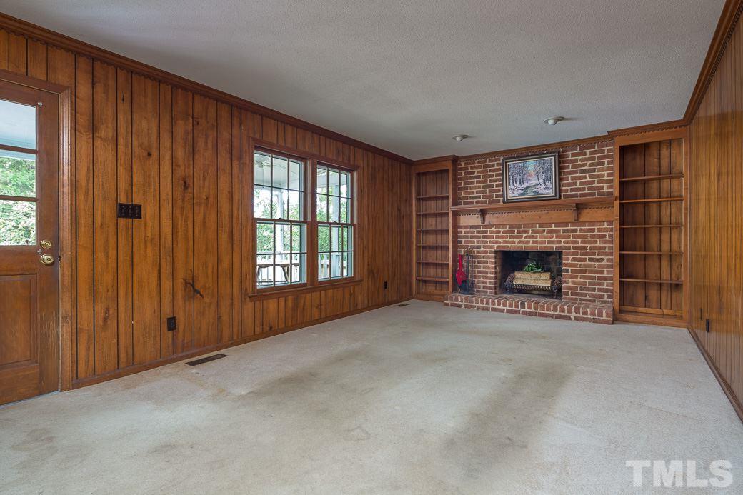 6700 Colony Court Raleigh, NC 27613 - Photo 5 of 21 Great sized family room boasts brick wood-burning fireplace. Built-in bookshelves, decorative crown molding & mantle are great features, too!