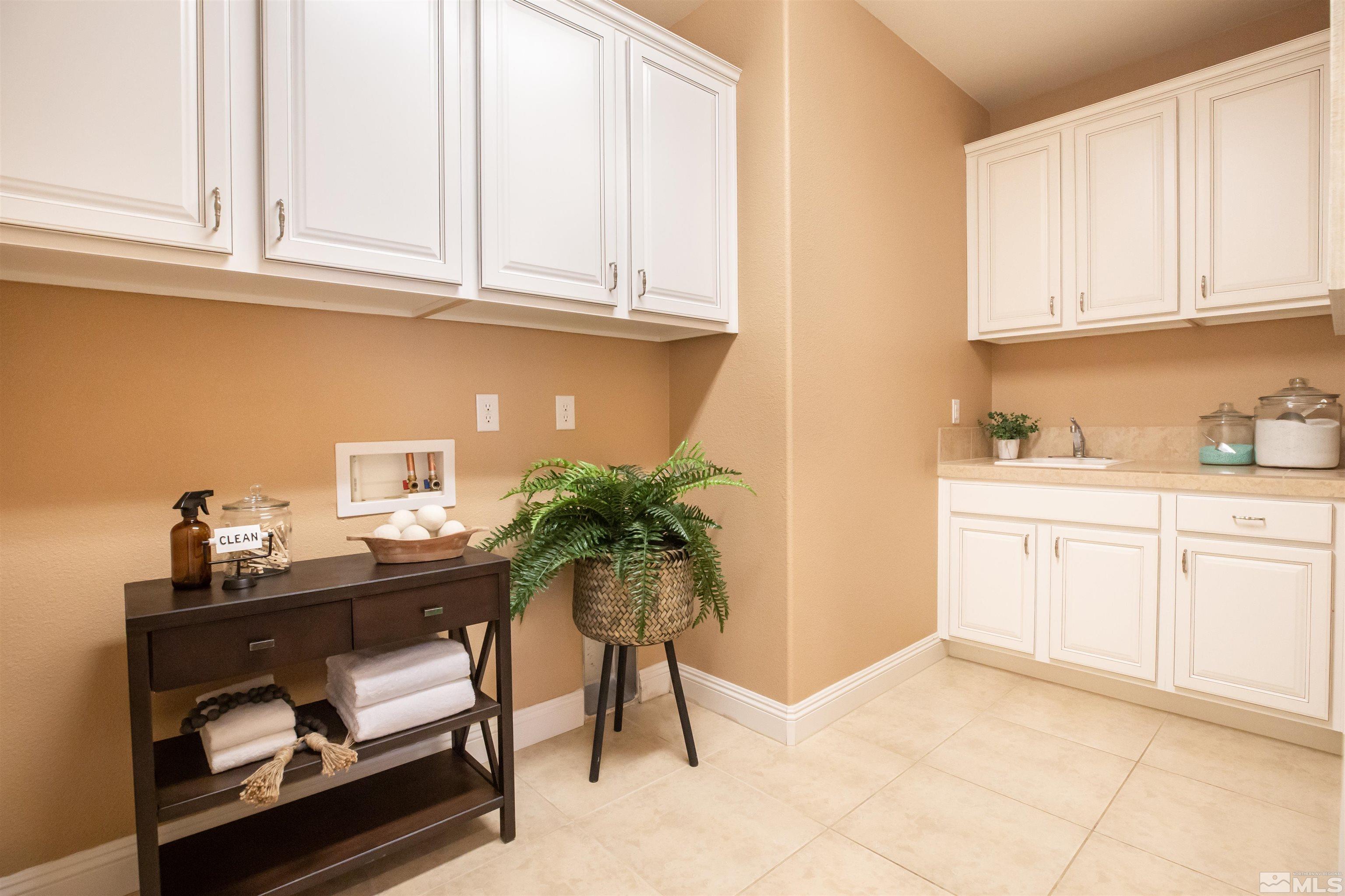 2735 Foxhunter Lane Reno, NV 89521 - Photo 23 of 31 a kitchen with stainless steel appliances granite countertop a refrigerator sink and cabinets