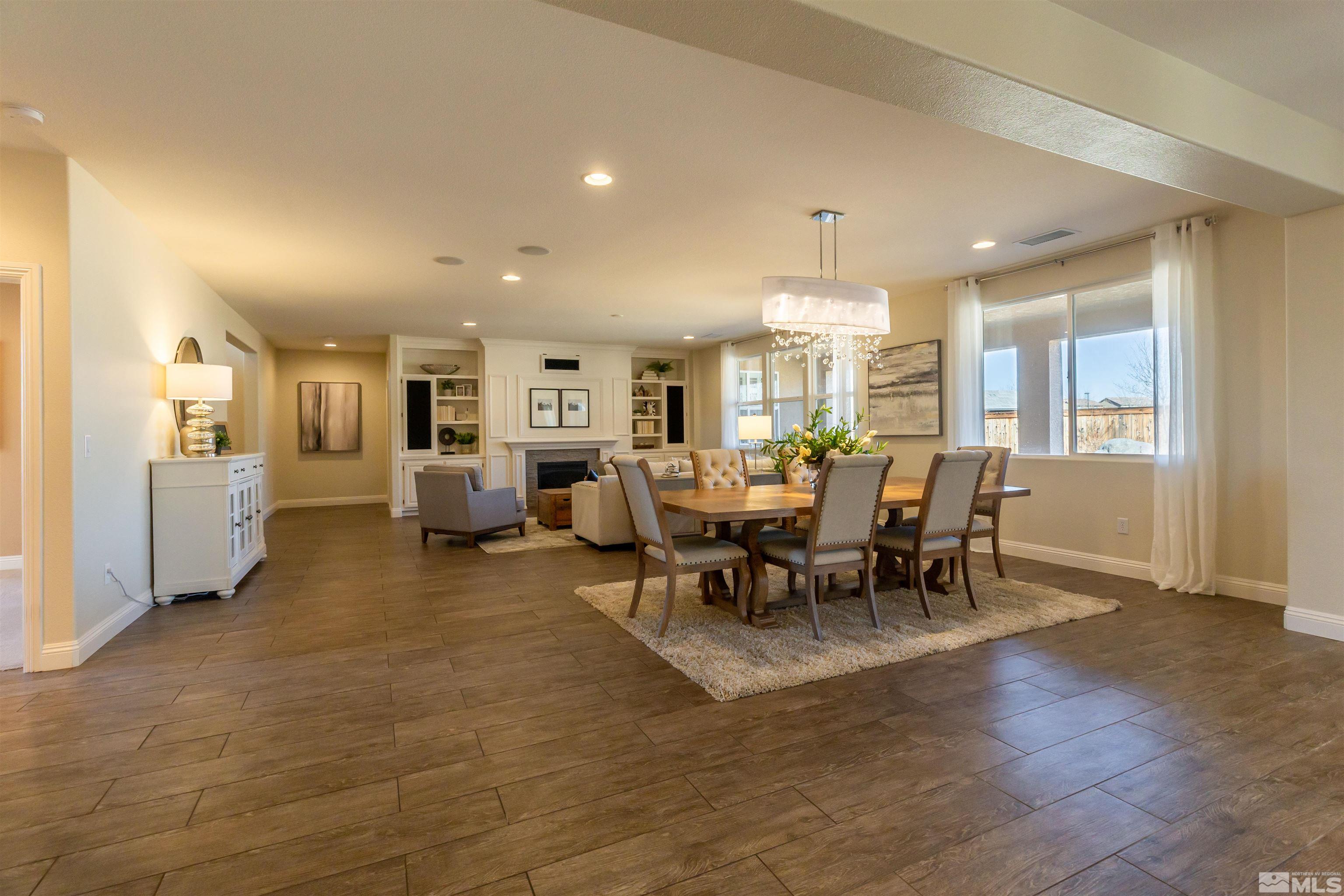 2735 Foxhunter Lane Reno, NV 89521 - Photo 25 of 31 a view of a dining area with furniture and chandelier
