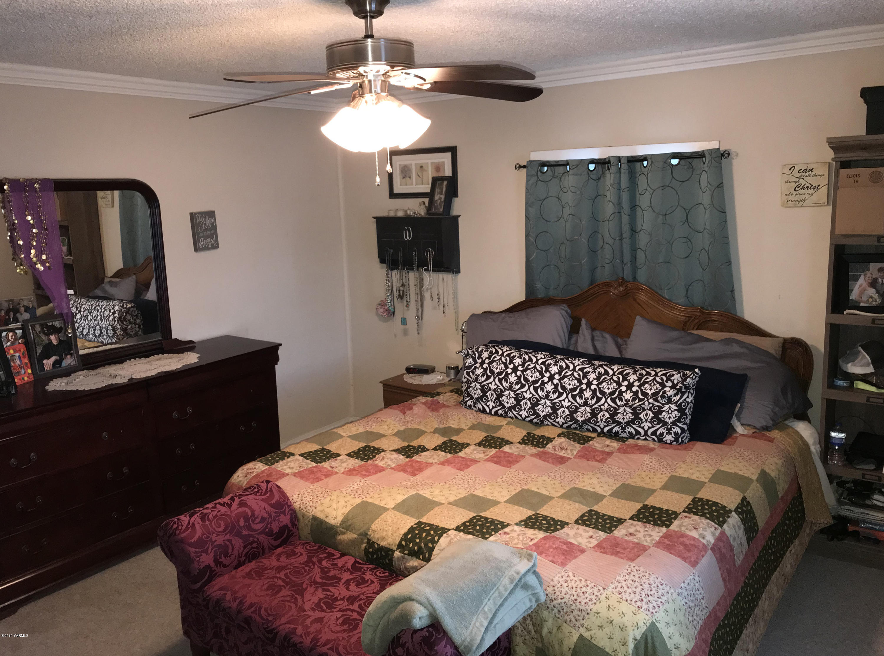 2551 Independence Road Outlook, WA 98938 - Photo 5 of 21 a bedroom with a large bed and a dresser
