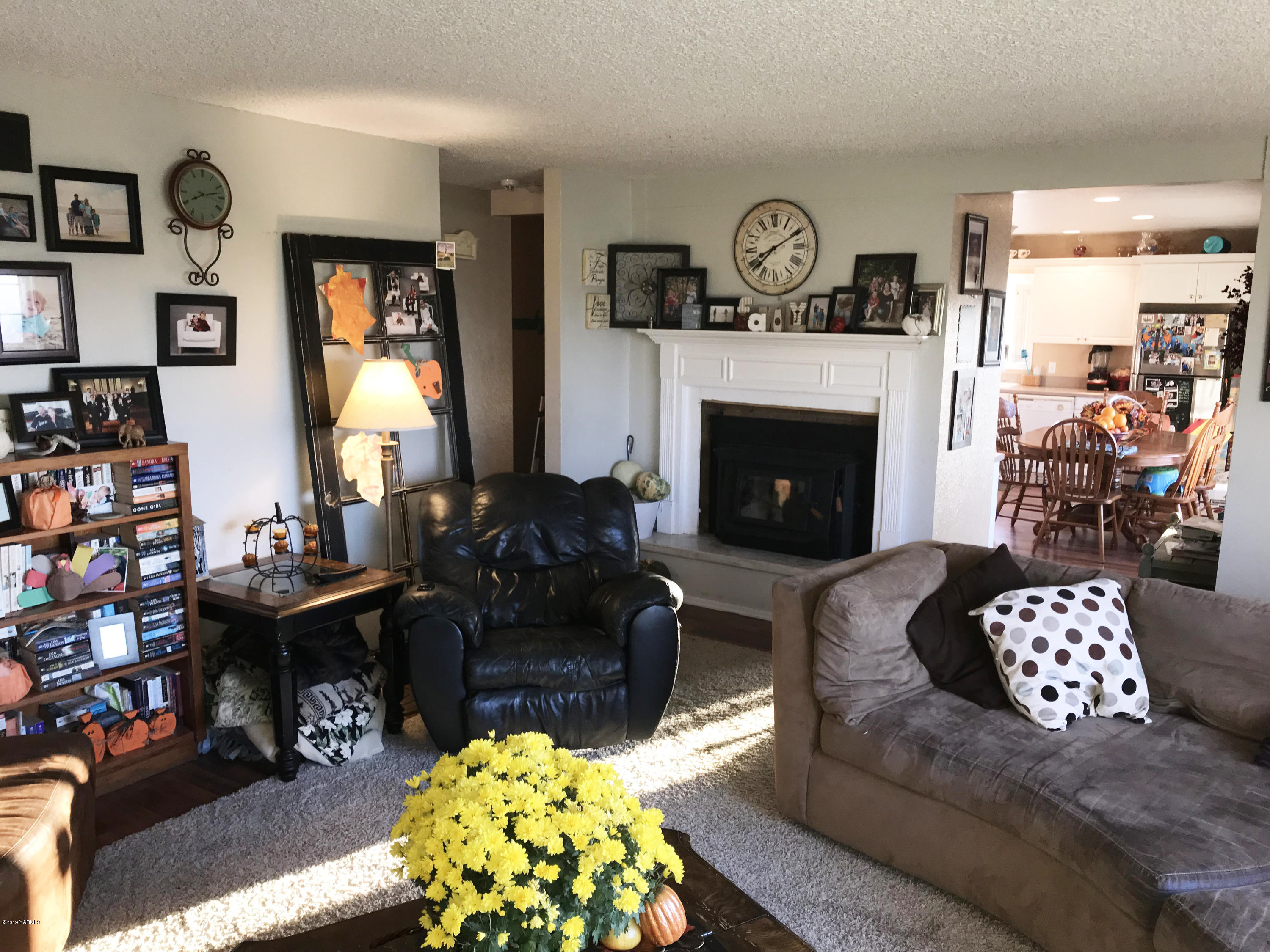 2551 Independence Road Outlook, WA 98938 - Photo 6 of 21 a living room with furniture a fireplace and a floor to ceiling window