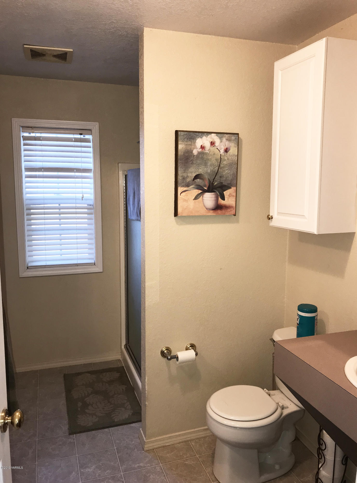2551 Independence Road Outlook, WA 98938 - Photo 7 of 21 a bathroom with a toilet a sink and a window