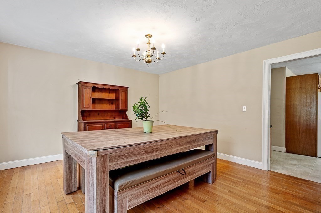557 Cronin Road Warren, MA 01585 - Photo 11 of 28 a view of a room with furniture and wooden floor