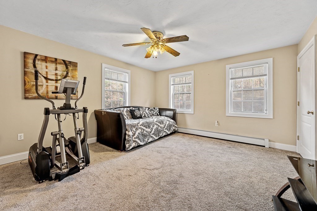 557 Cronin Road Warren, MA 01585 - Photo 13 of 28 a view of a livingroom with furniture and windows