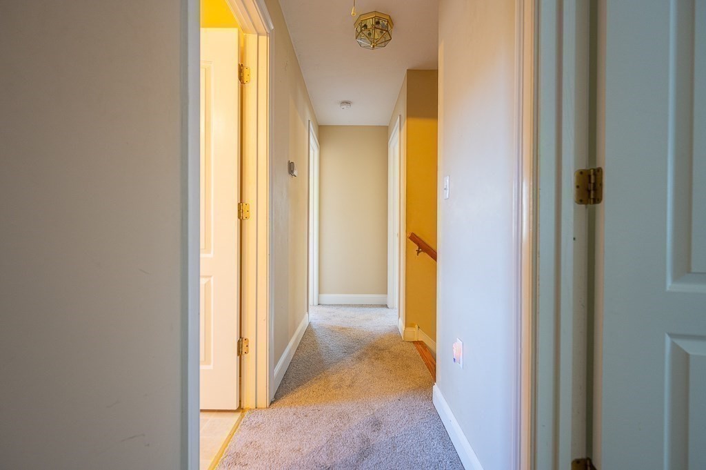 557 Cronin Road Warren, MA 01585 - Photo 19 of 28 a view of a bathroom from a hallway