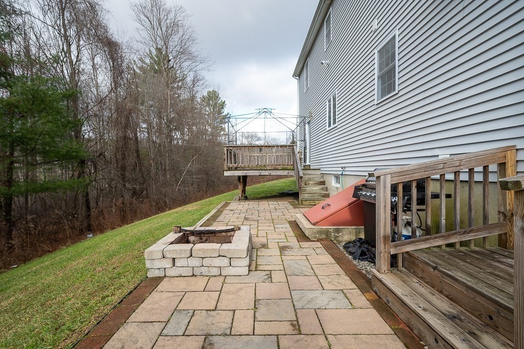 557 Cronin Road Warren, MA 01585 - Photo 21 of 28 a view of a backyard with sitting area