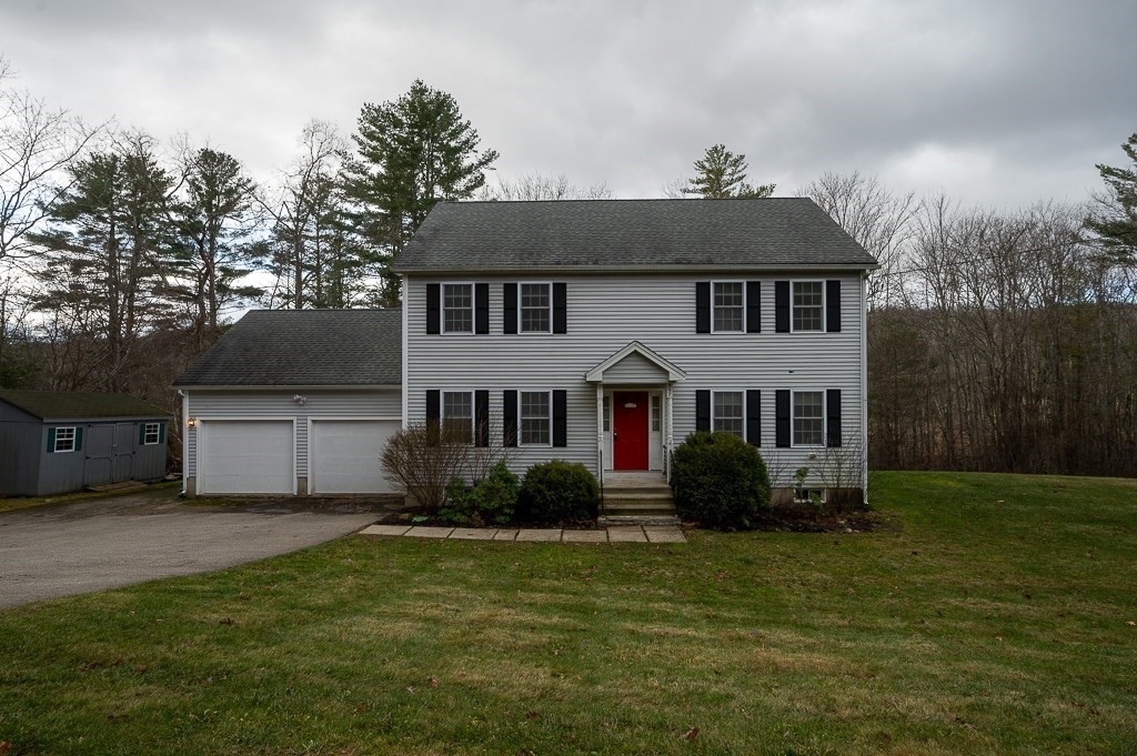 557 Cronin Road Warren, MA 01585 - Photo 28 of 28 a front view of a house with a garden