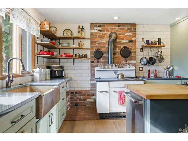 a kitchen with a sink stove and cabinets