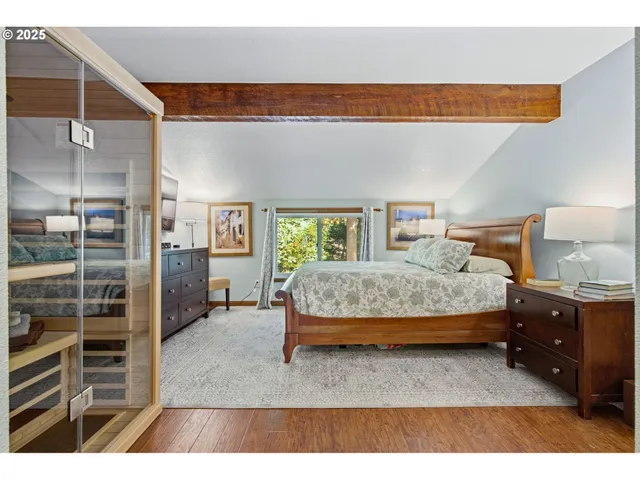 a bathroom with a sink a mirror and a shower