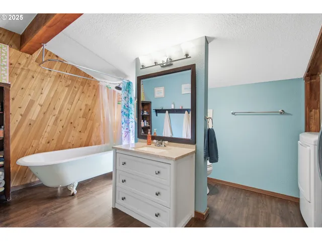 a bathroom with a bathtub and a shower