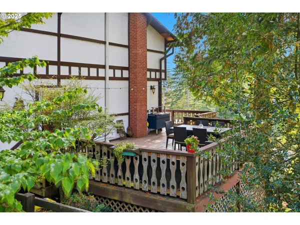 a view of a patio with table and chairs with wooden floor