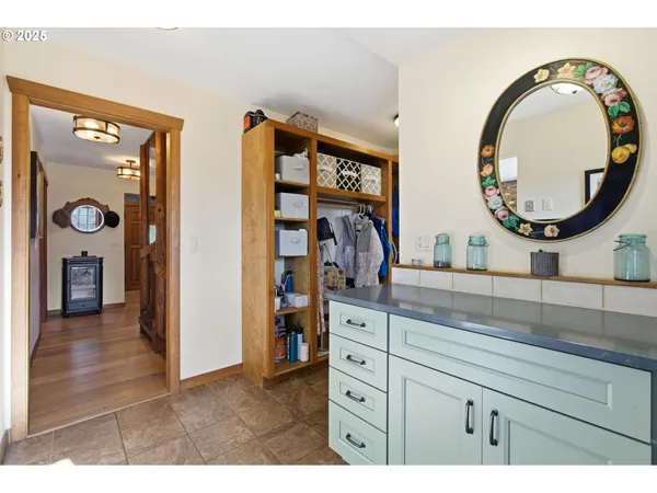 a view of a dining room with furniture and a chandelier