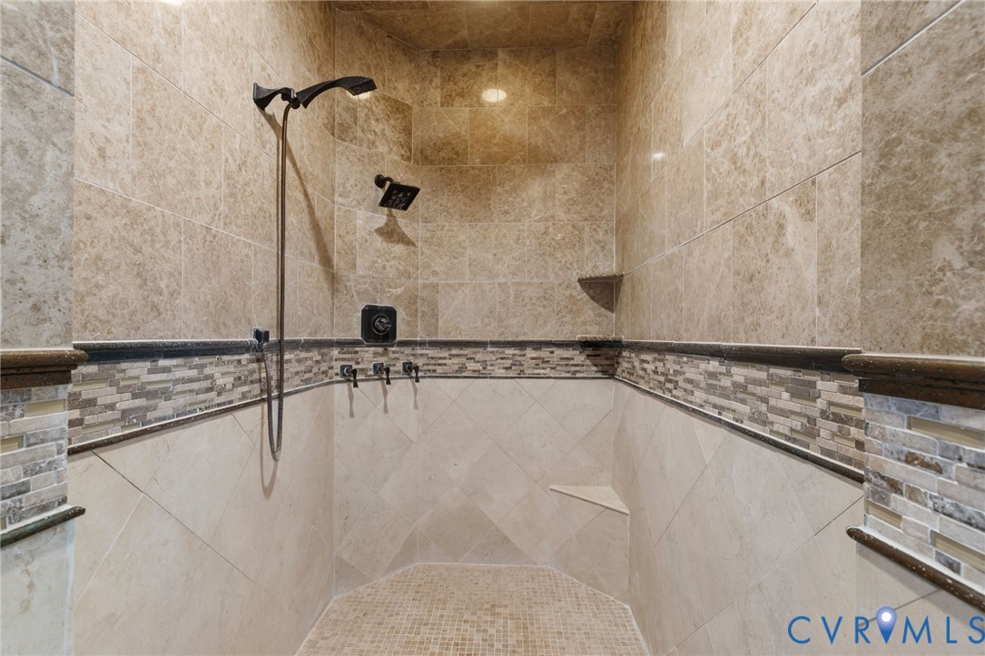 2365 State Rte 635 Midlothian, VA 23113 - Photo 20 of 64 Walk-in shower featuring dual shower heads, mosaic