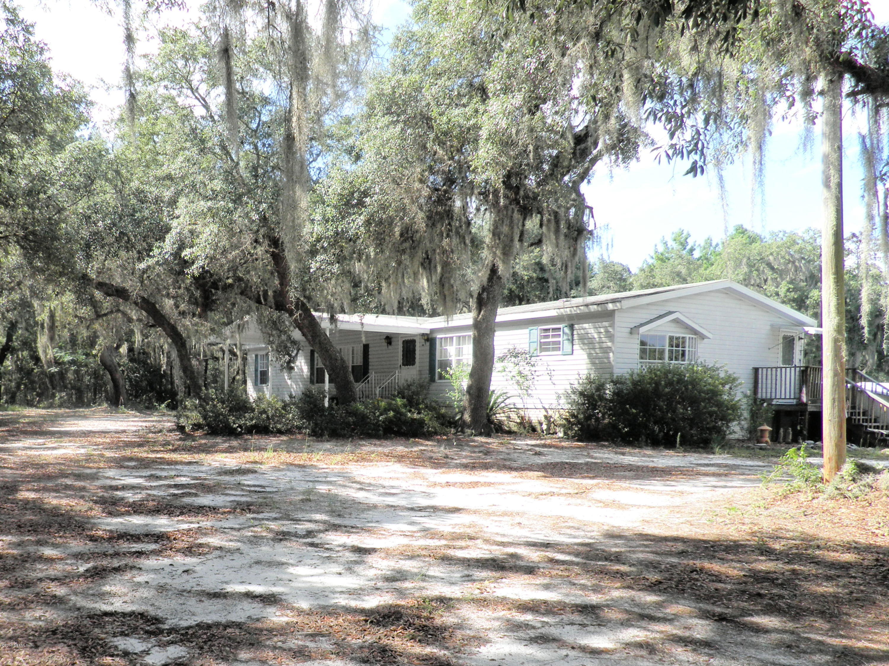 268 Beulah Church Road Welaka, FL 32112 - Photo 1 of 33 a front view of house with yard and trees around