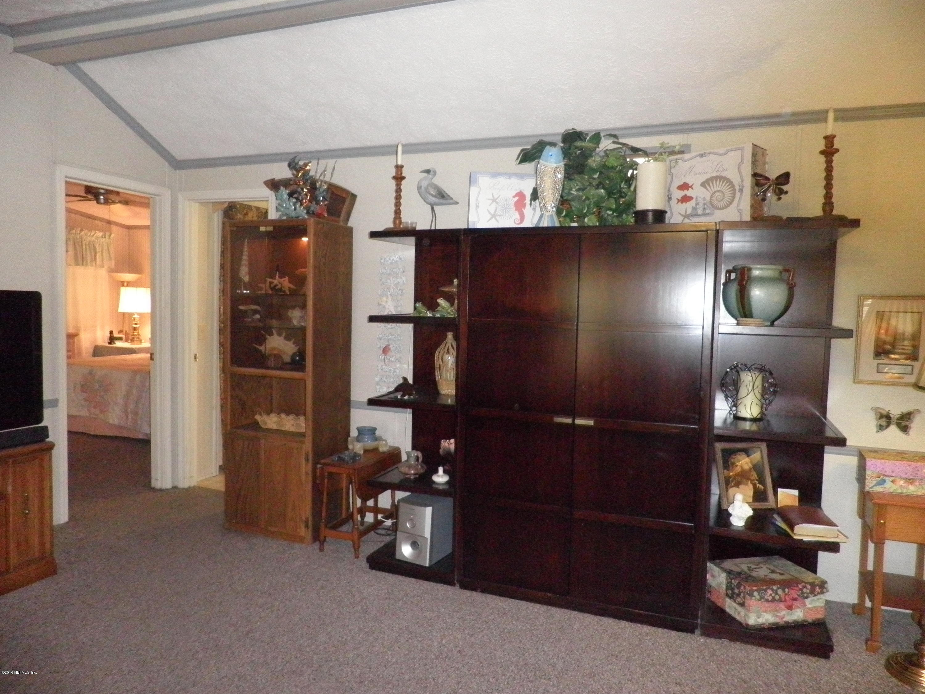 268 Beulah Church Road Welaka, FL 32112 - Photo 14 of 33 a view of livingroom with furniture and storage