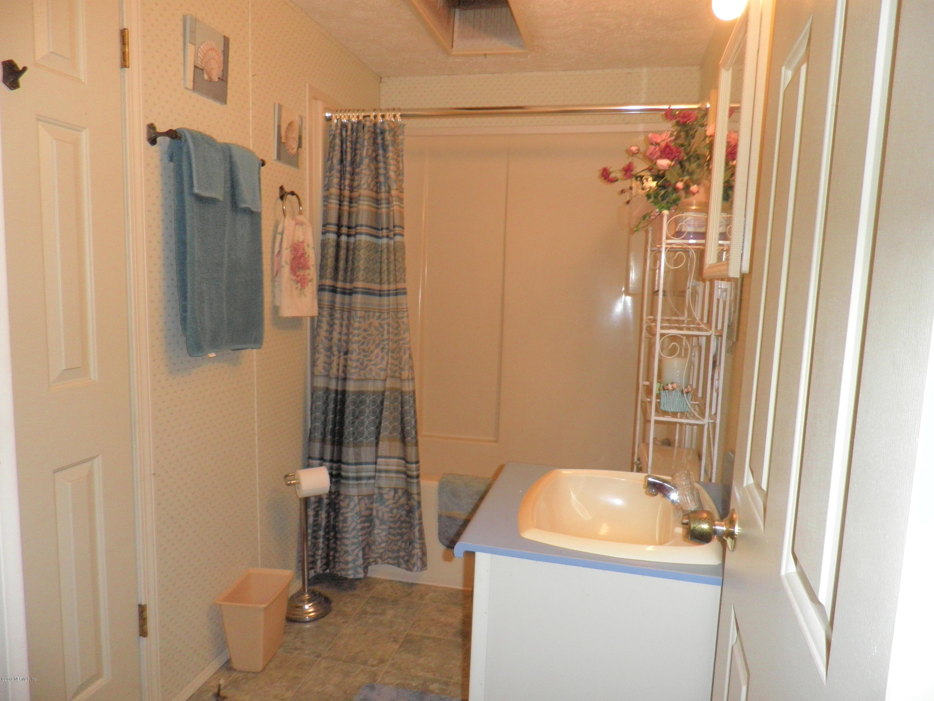 268 Beulah Church Road Welaka, FL 32112 - Photo 26 of 33 a bathroom with a sink toilet and shower