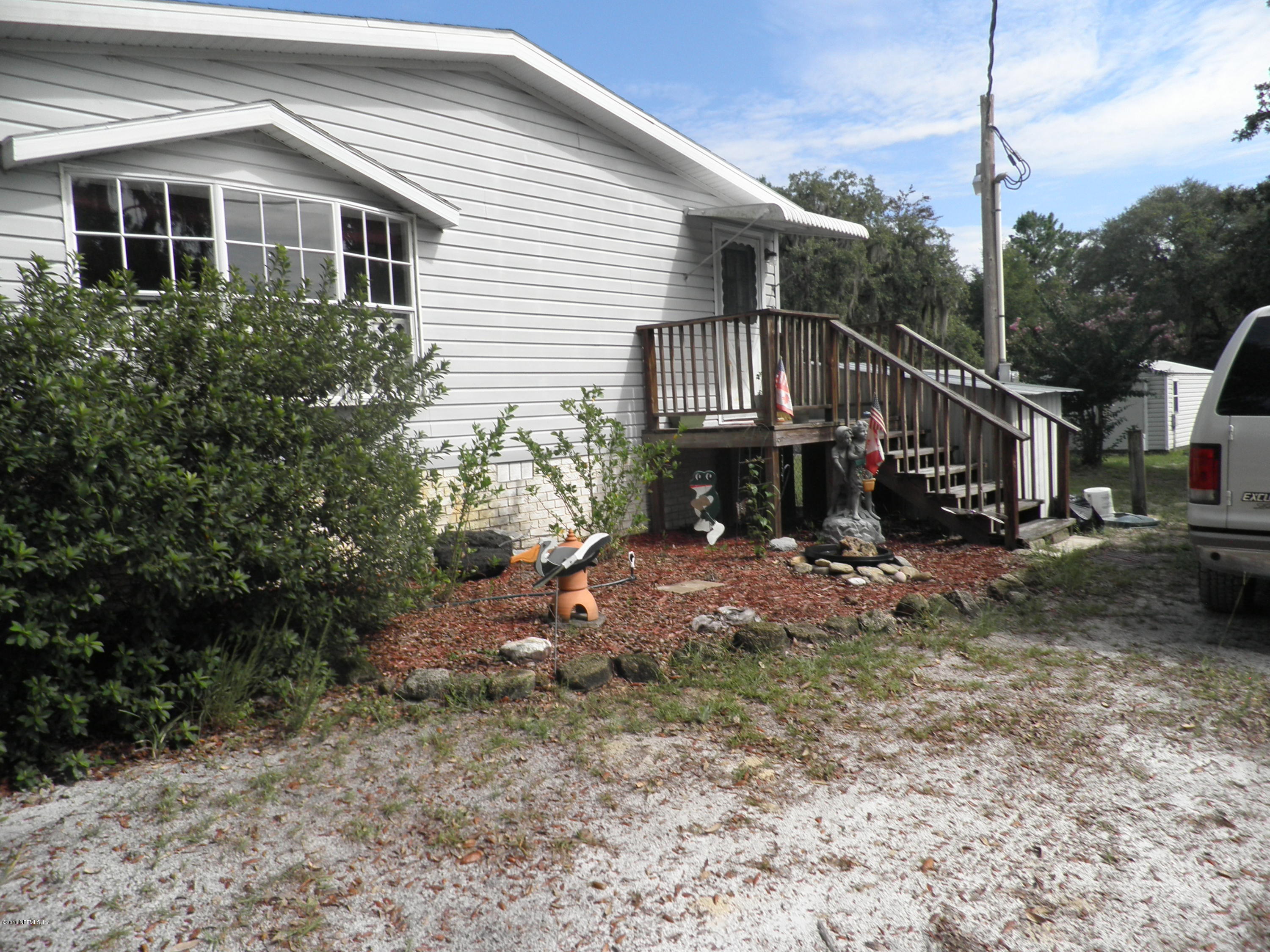 268 Beulah Church Road Welaka, FL 32112 - Photo 33 of 33 a view of a house with a yard