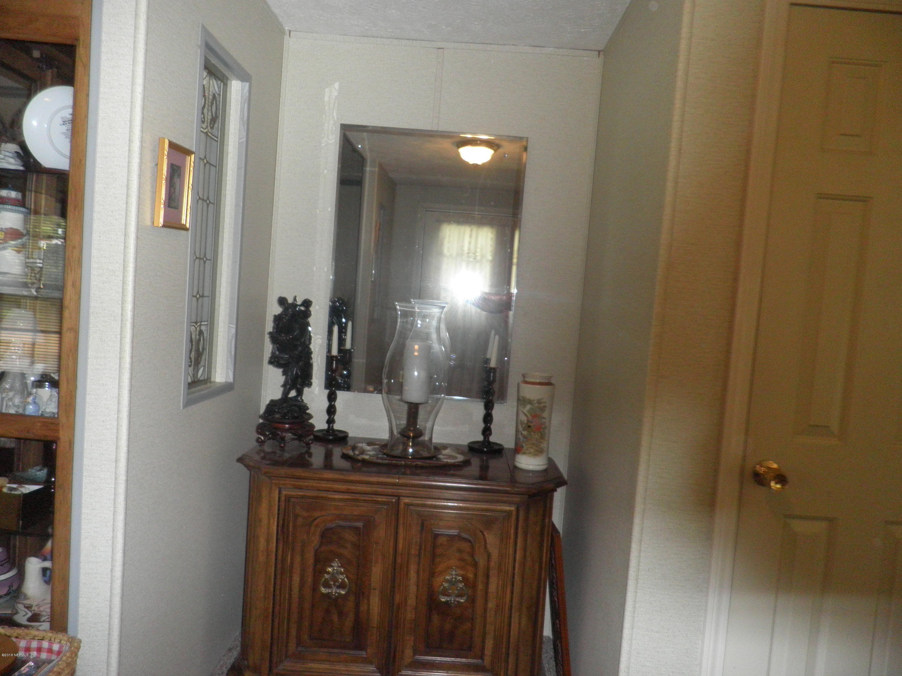 268 Beulah Church Road Welaka, FL 32112 - Photo 5 of 33 a kitchen with a sink and cabinets