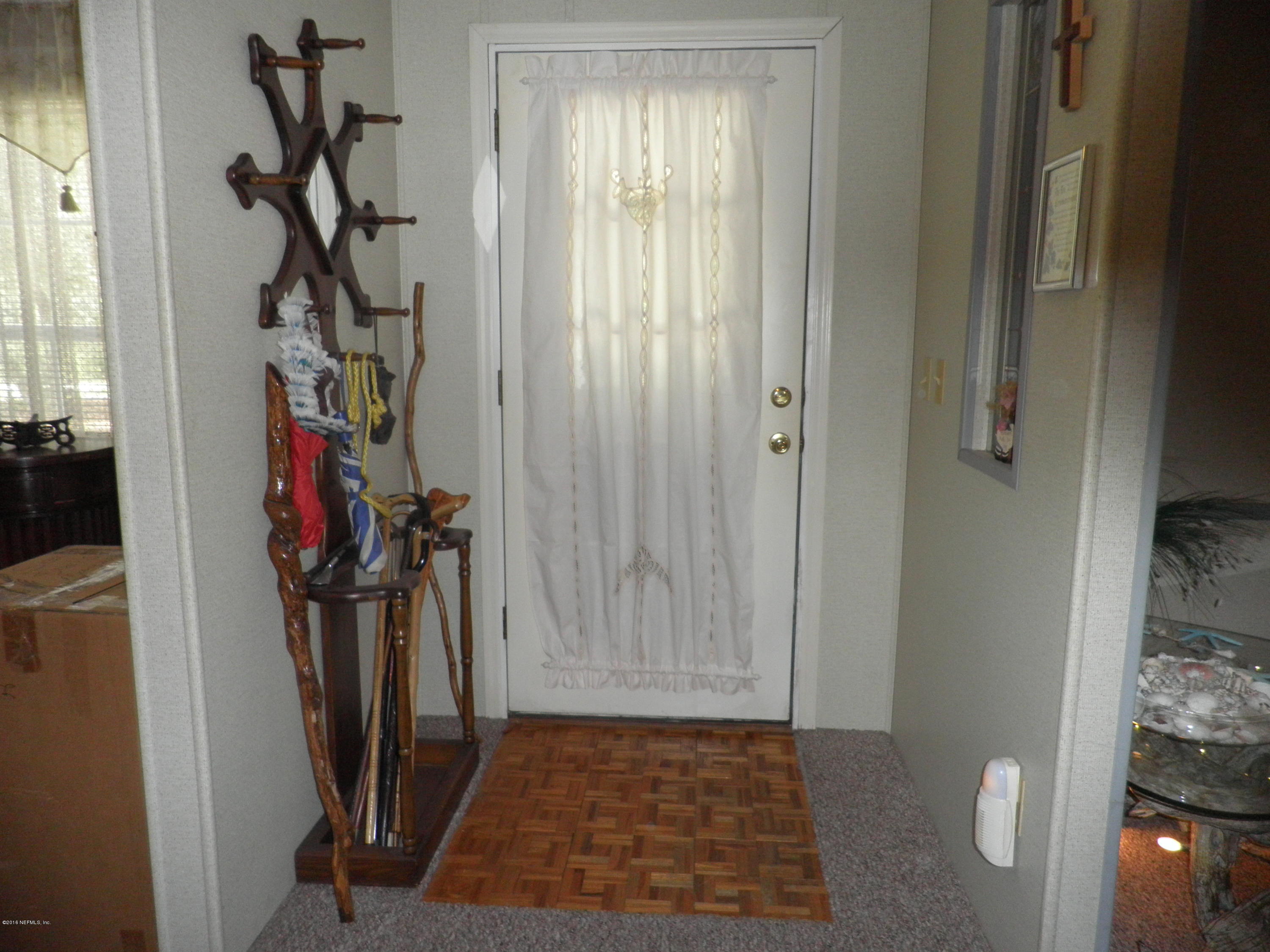 268 Beulah Church Road Welaka, FL 32112 - Photo 6 of 33 a view of a hallway with front door