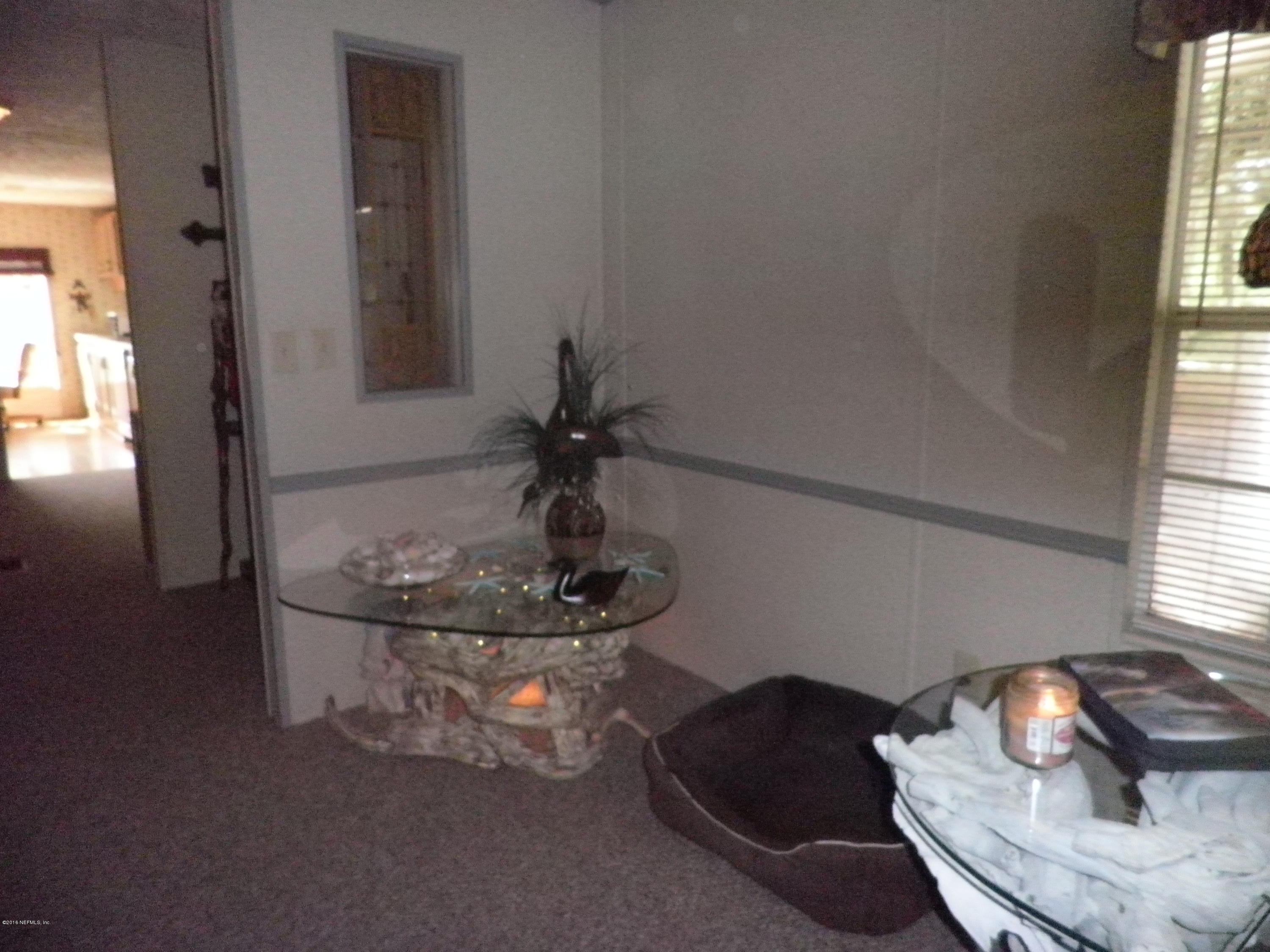 268 Beulah Church Road Welaka, FL 32112 - Photo 10 of 33 a room with furniture and window