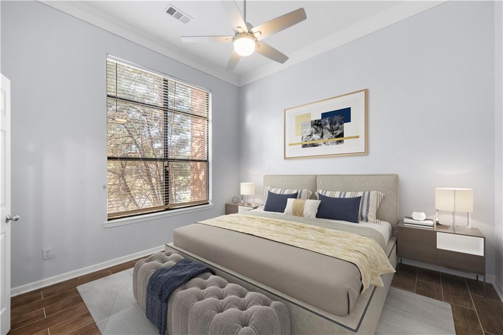 400 17th Street Northwest, Unit 1113 Atlanta, GA 30363 - Photo 17 of 37 a bedroom with a bed and a window