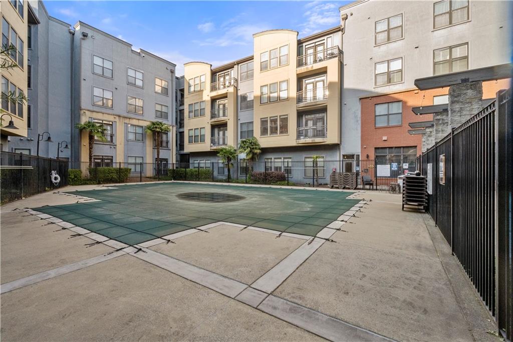 400 17th Street Northwest, Unit 1113 Atlanta, GA 30363 - Photo 32 of 37 a view of a building with a yard