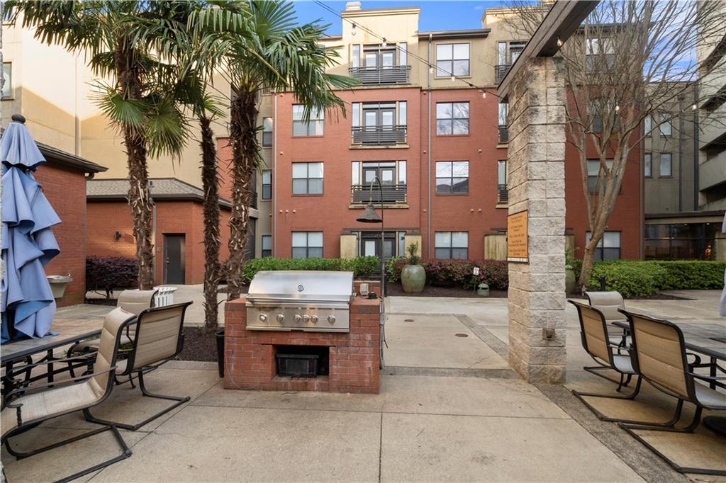 400 17th Street Northwest, Unit 1113 Atlanta, GA 30363 - Photo 34 of 37 a view of a brick building with many windows