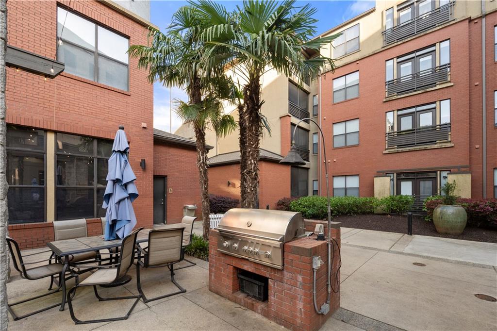 400 17th Street Northwest, Unit 1113 Atlanta, GA 30363 - Photo 35 of 37 a car parked in front of brick building