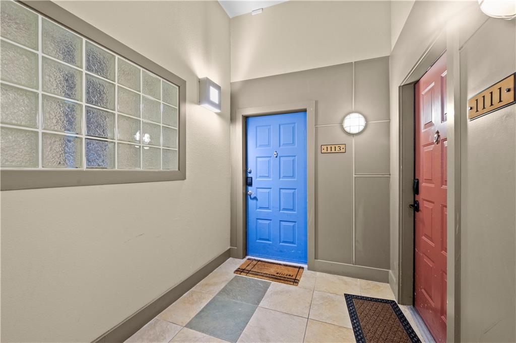400 17th Street Northwest, Unit 1113 Atlanta, GA 30363 - Photo 7 of 37 a view of front door with wooden floor