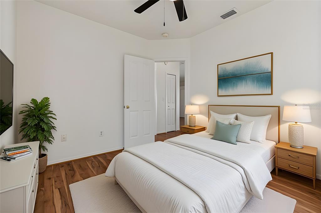 5311 Watson Road Riverview, FL 33578 - Photo 25 of 33 a bedroom with a bed and a potted plant