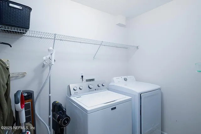 a view of a house with a yard and a porch