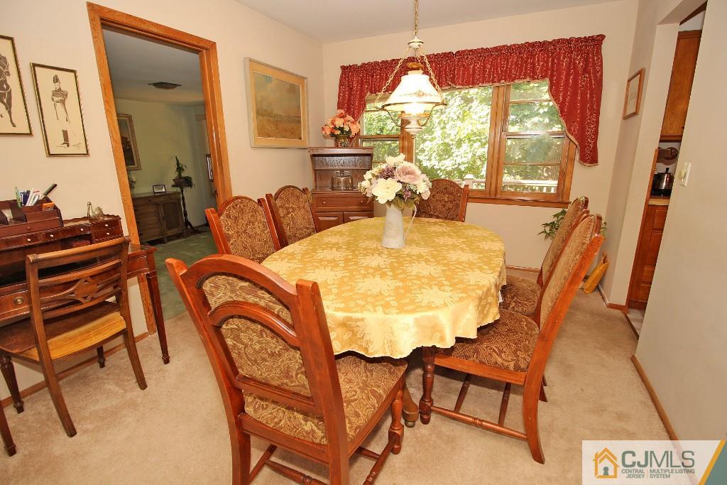 9 Gales Road Edison, NJ 08837 - Photo 11 of 25 a view of a dining room with furniture wooden floor and a chandelier