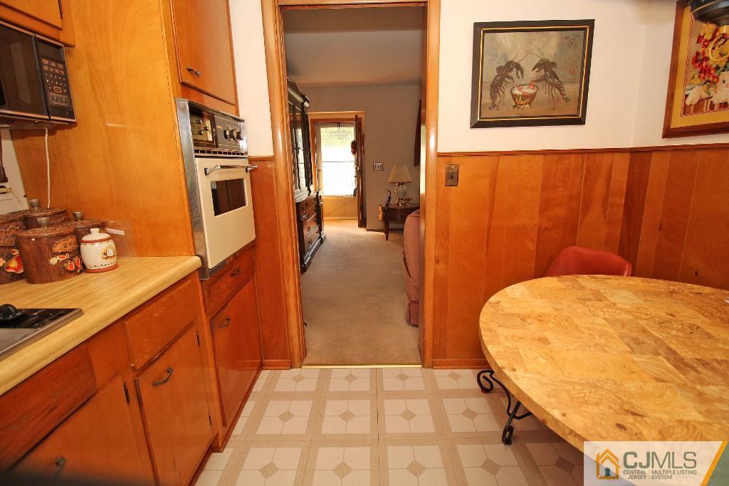 9 Gales Road Edison, NJ 08837 - Photo 18 of 25 a view of a hallway with paintings on the wall