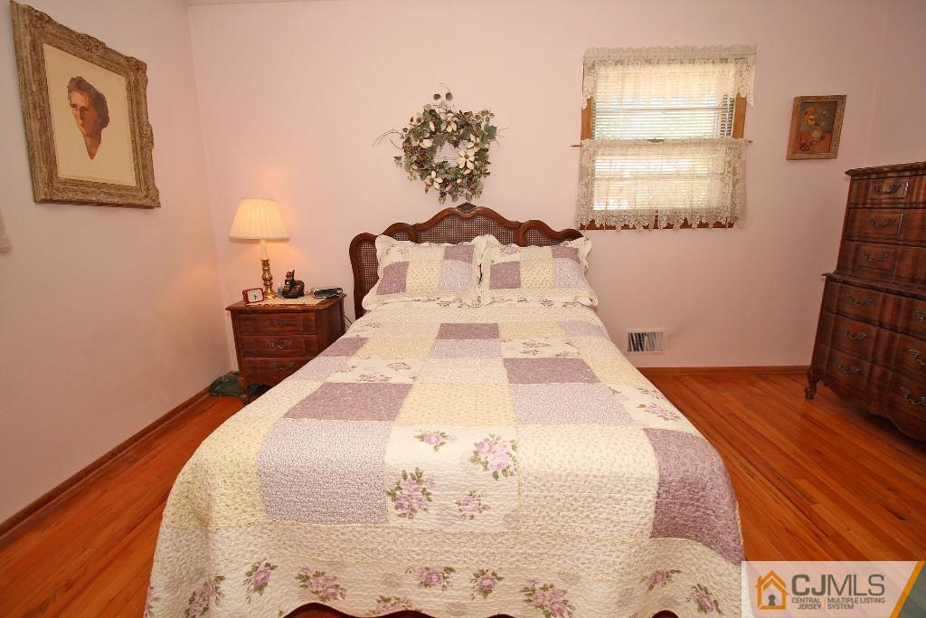 9 Gales Road Edison, NJ 08837 - Photo 20 of 25 a view of a bedroom with wooden floor and bedroom