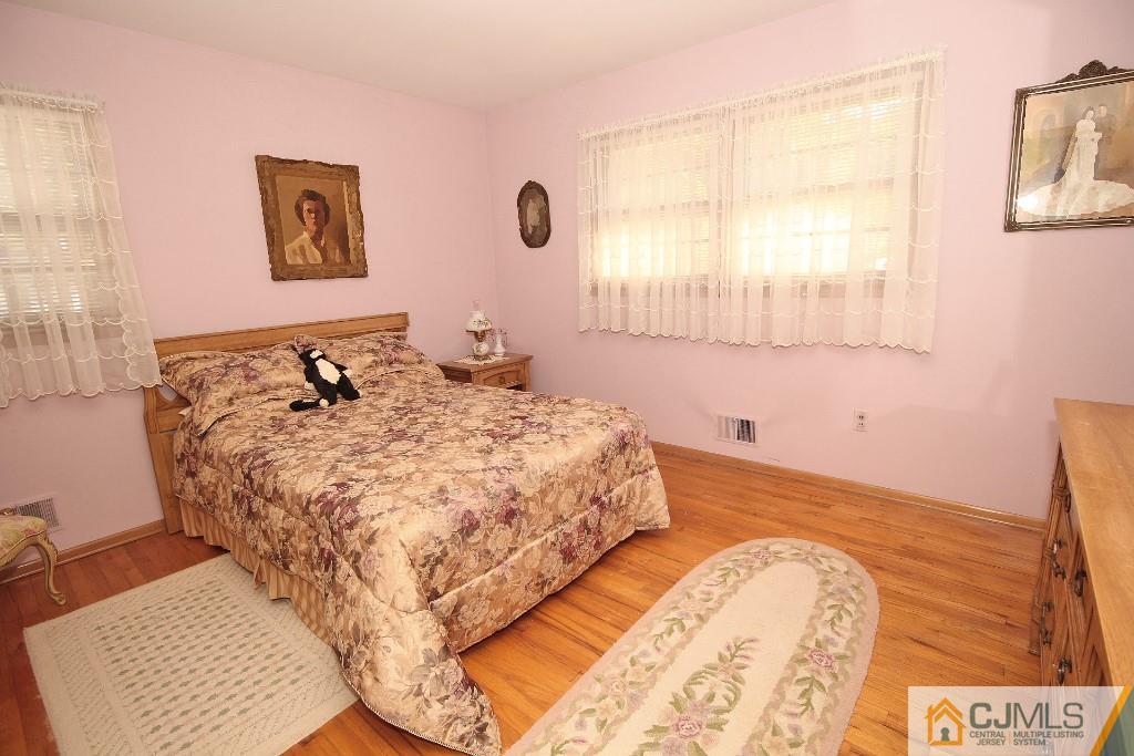 9 Gales Road Edison, NJ 08837 - Photo 21 of 25 a bedroom with a bed and a window
