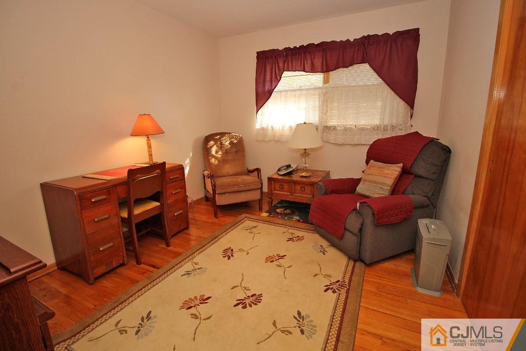 9 Gales Road Edison, NJ 08837 - Photo 22 of 25 a living room with furniture fireplace and a window