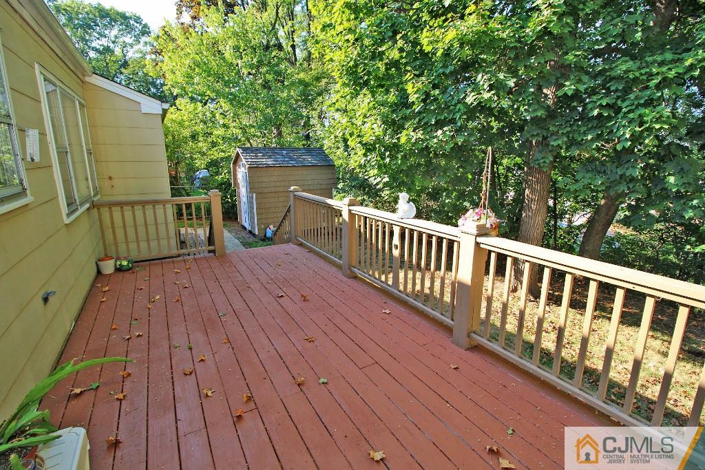9 Gales Road Edison, NJ 08837 - Photo 23 of 25 a view of a wooden deck and a yard with wooden fence