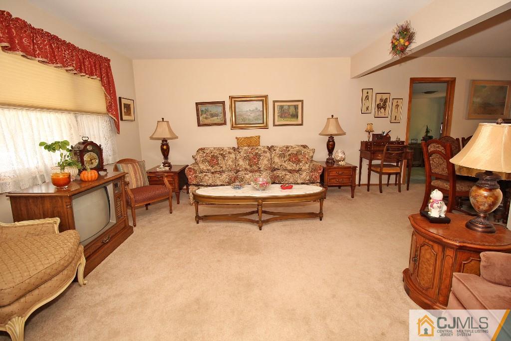 9 Gales Road Edison, NJ 08837 - Photo 7 of 25 a living room with furniture and a flat screen tv