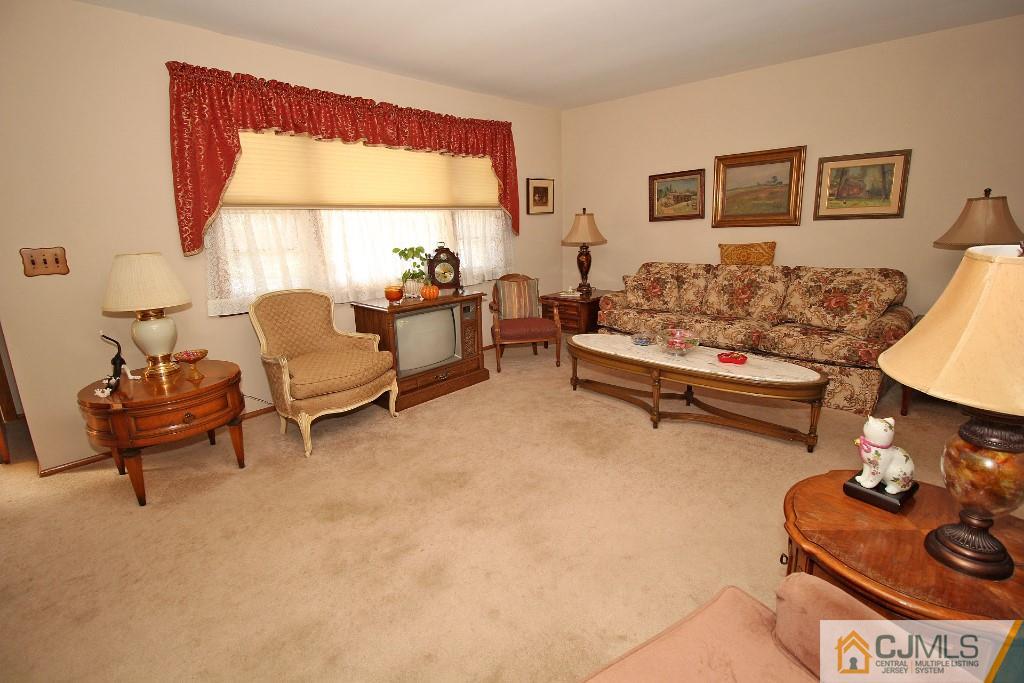 9 Gales Road Edison, NJ 08837 - Photo 8 of 25 a living room with furniture and a window