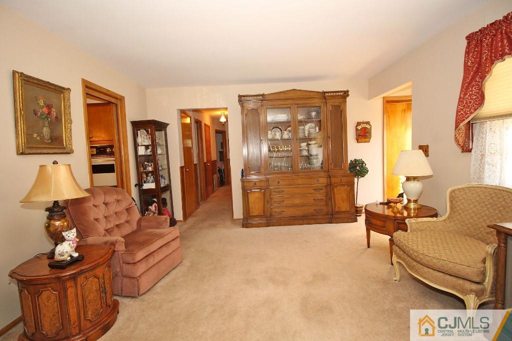 9 Gales Road Edison, NJ 08837 - Photo 9 of 25 a living room with furniture and a flat screen tv