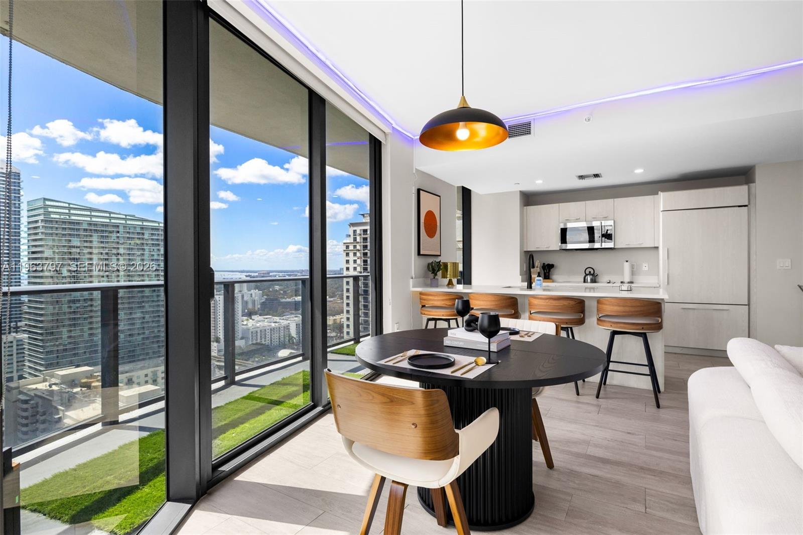 45 Southwest 9th Street, Unit 2803 Miami, FL 33130 - Photo 18 of 66 a view of a dining room with furniture window and outside view